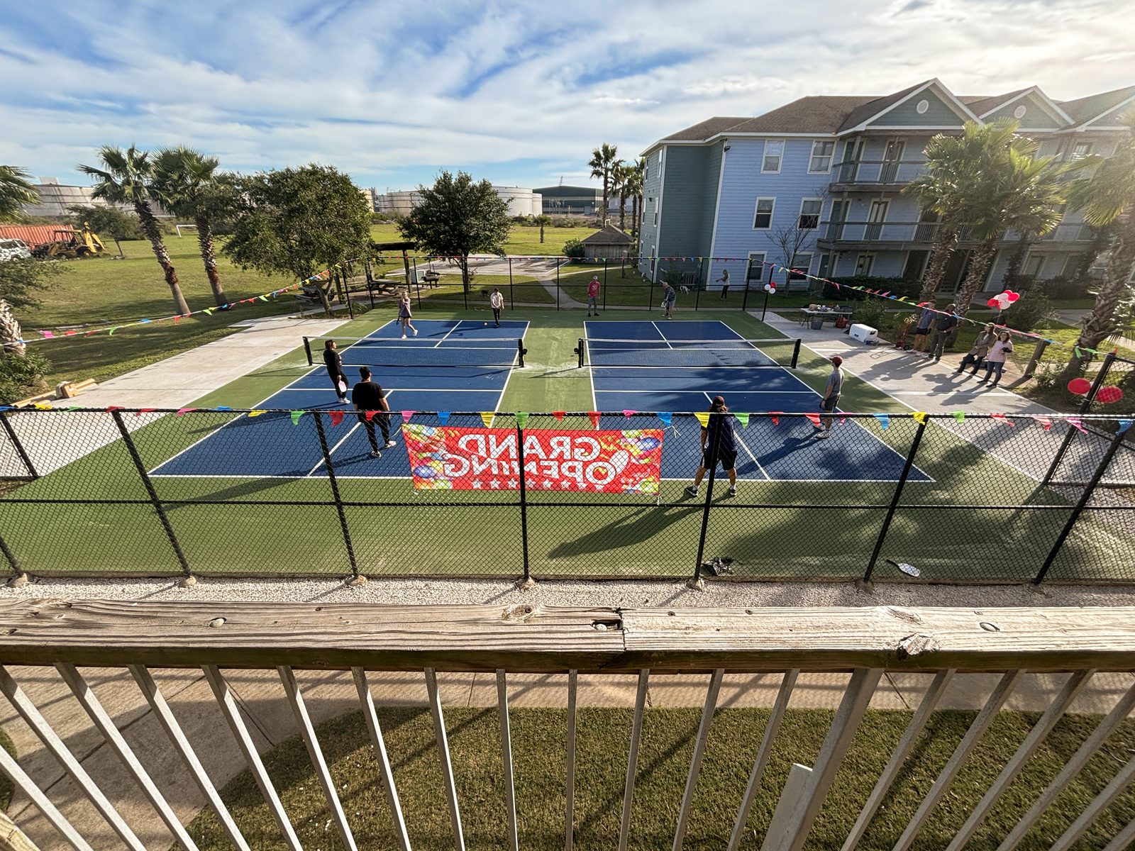 Aerial view of the pickleball court and apartment building