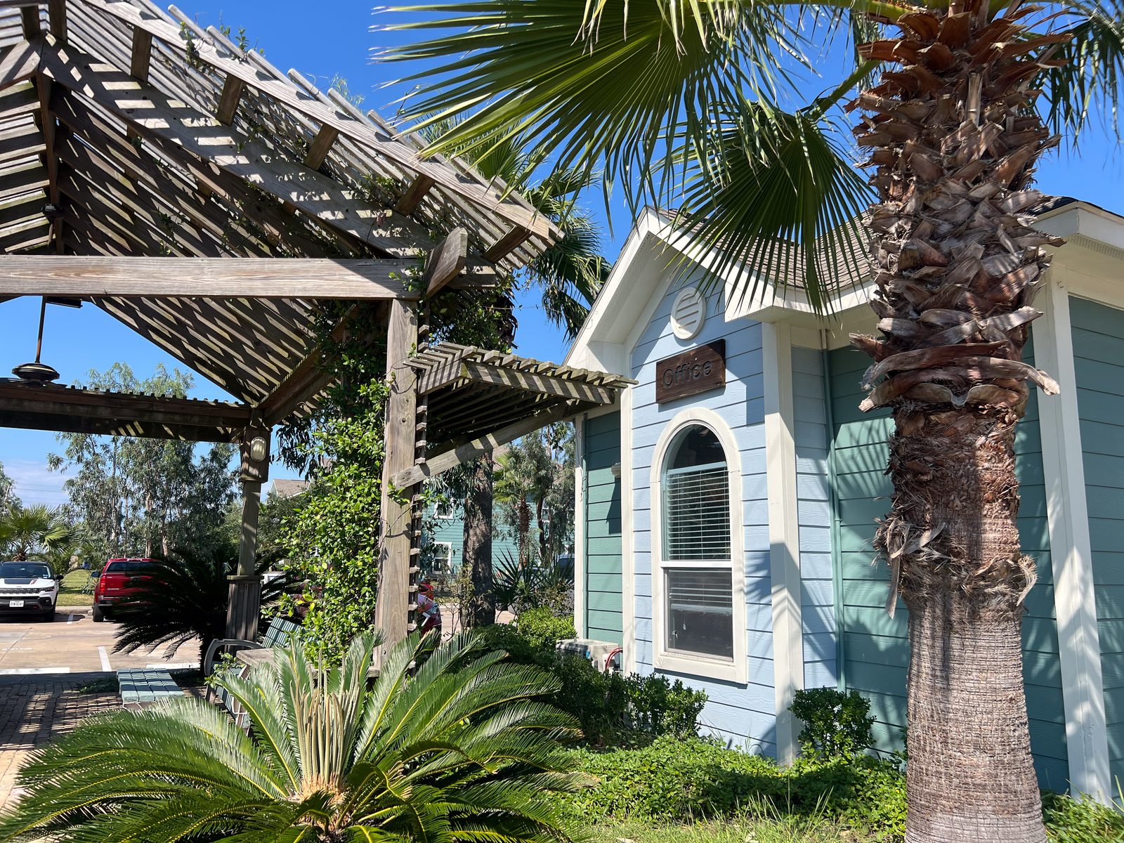 Apartment entrance and pergola landscaping at UAG