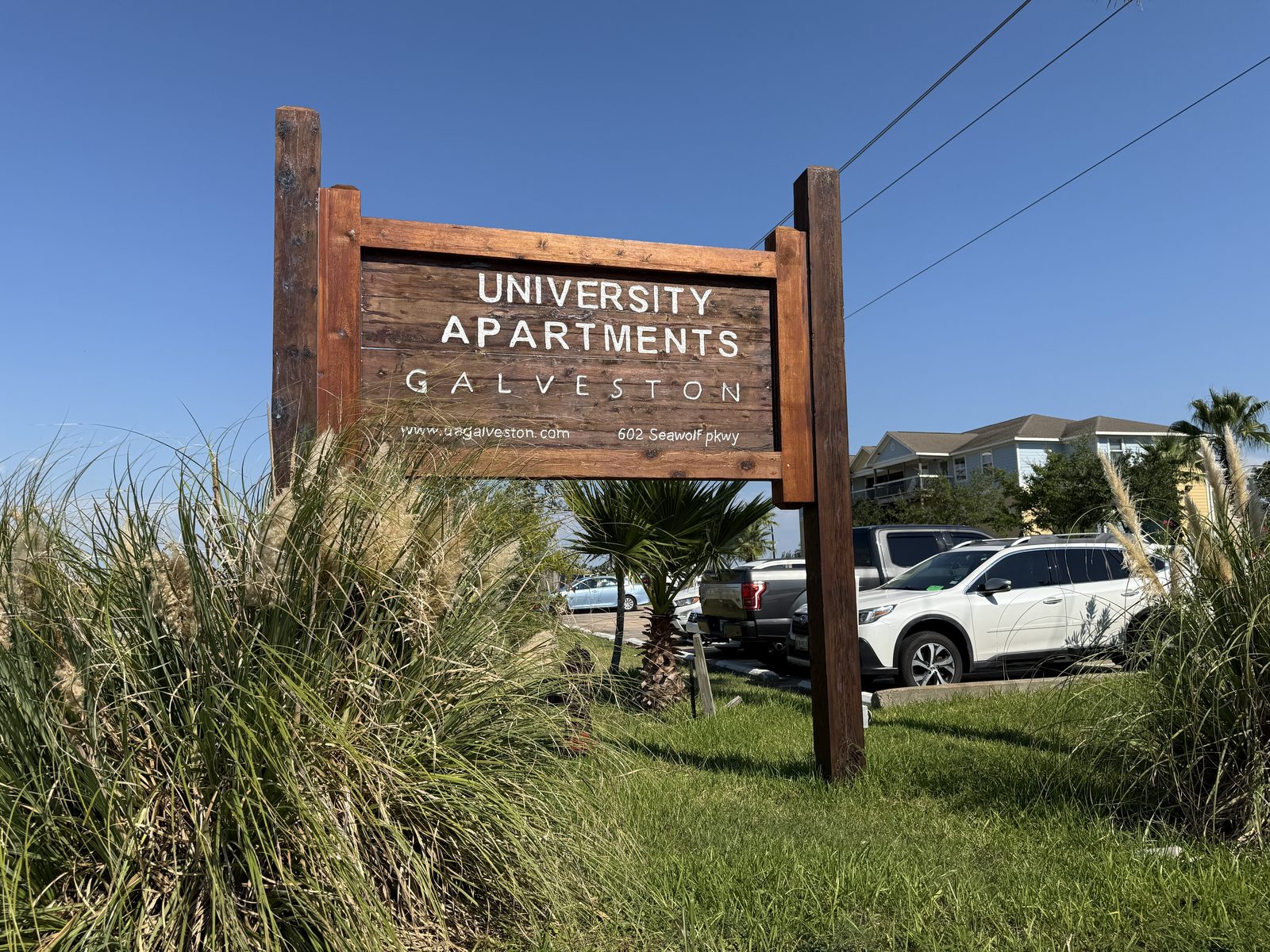 University Apartments Galveston property sign
